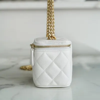 Chanel small gold ball makeup bag