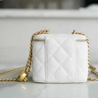 Chanel small gold ball makeup bag