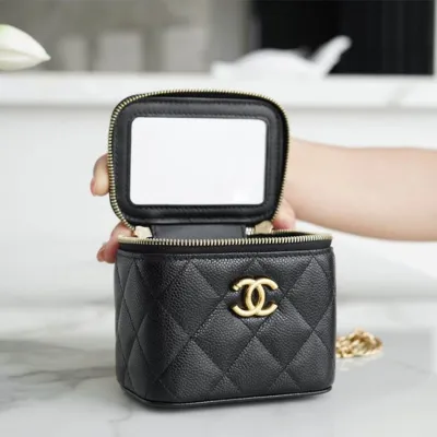 Chanel small gold ball makeup bag