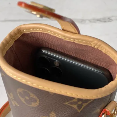 LV fold me clutch bag